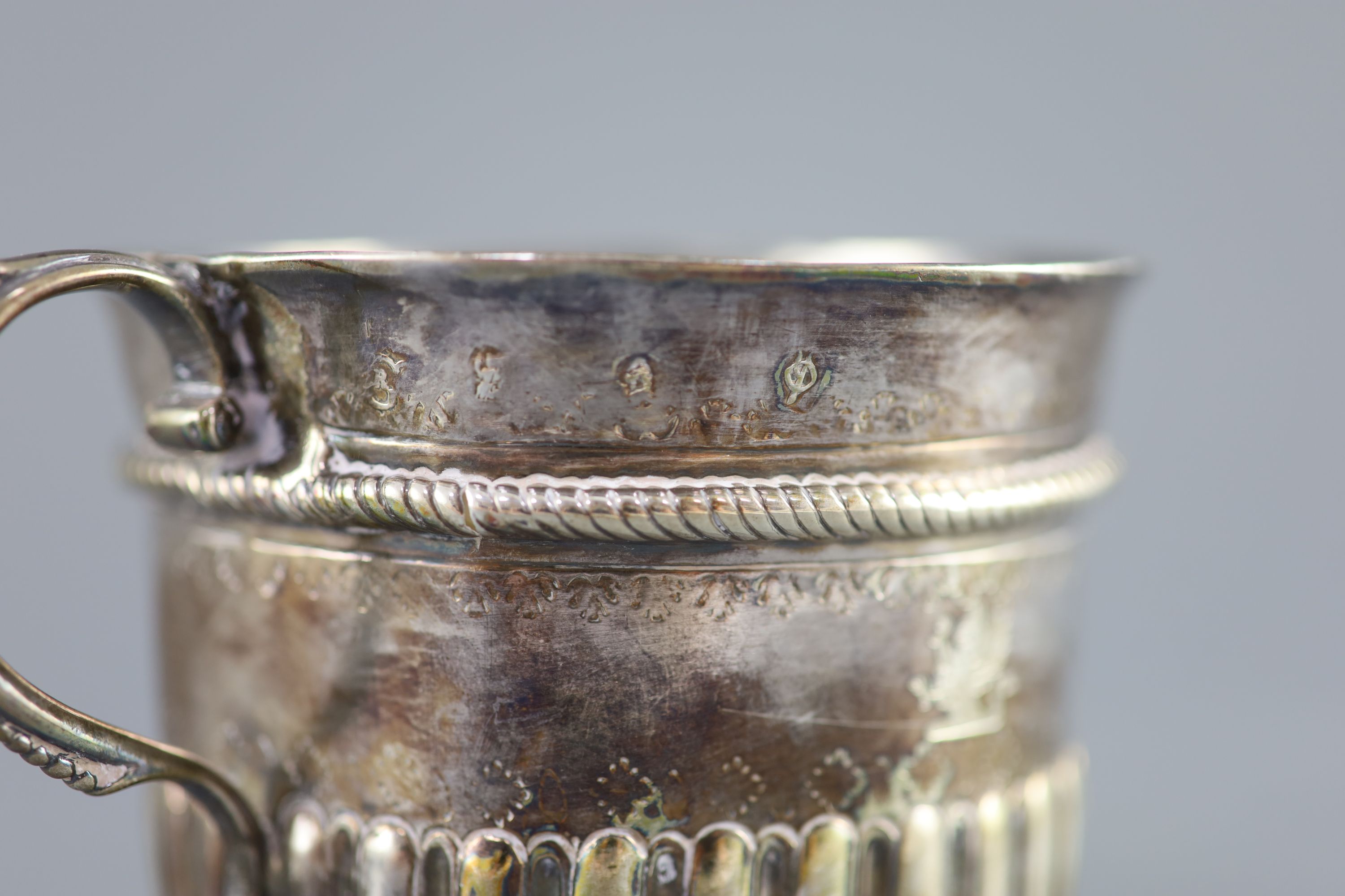 A Queen Anne demi-spiral fluted silver porringer